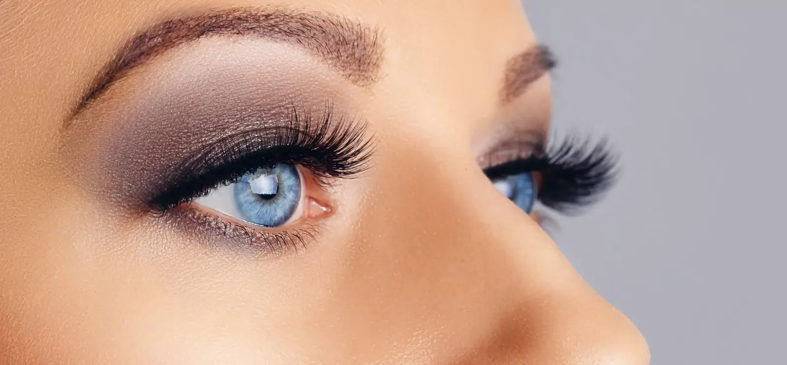 Close-up of full lashes and shaped brows